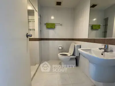 Modern bathroom with sleek fixtures and neutral tiles