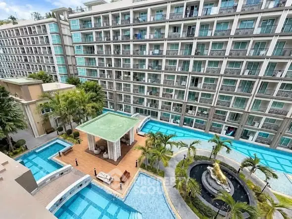 Luxurious condominium with stunning pool and modern architecture, perfect for upscale living.