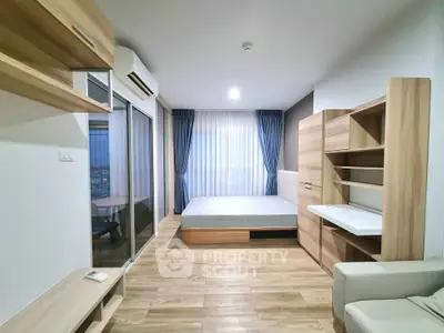 Modern minimalist bedroom with wooden flooring and built-in storage solutions.