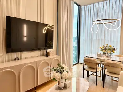 Luxurious modern living room with elegant dining area and floor-to-ceiling windows.