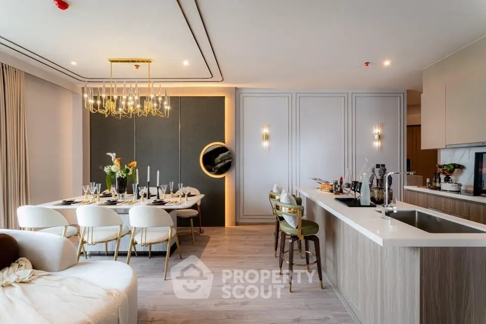 Luxurious open-plan living and dining area with modern kitchen and elegant decor