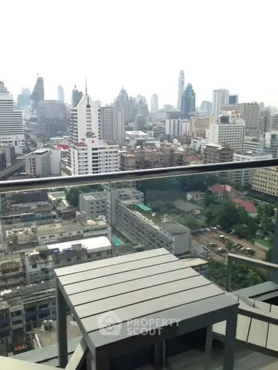 Stunning cityscape view from a modern balcony in a high-rise apartment.