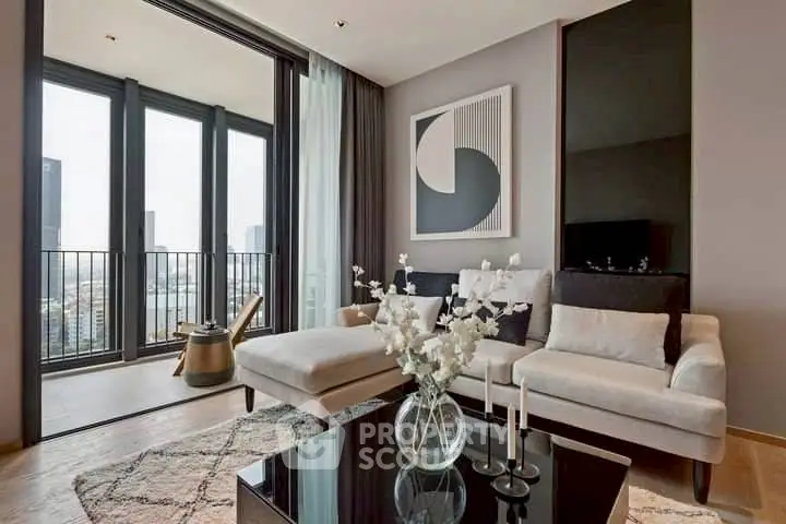 Modern living room with elegant decor and city view balcony, featuring a stylish sofa and chic artwork.