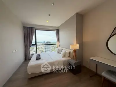 Modern bedroom with stunning city view and elegant decor