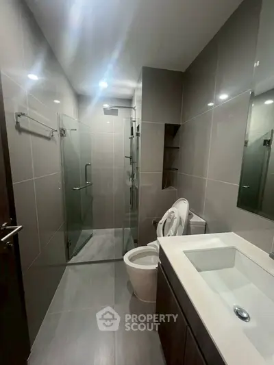 Modern bathroom with sleek design and glass shower enclosure