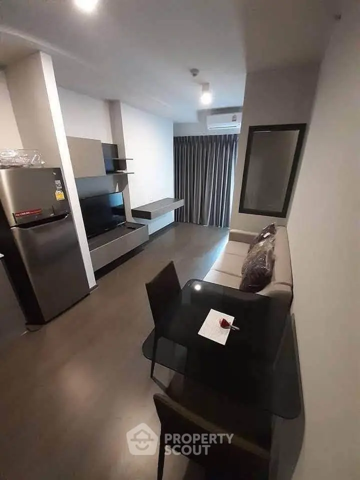 Modern living room with sleek furniture and open layout in a stylish apartment.