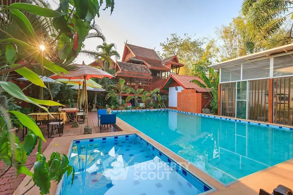 Stunning tropical villa with pool and lush garden, perfect for relaxation and luxury living.