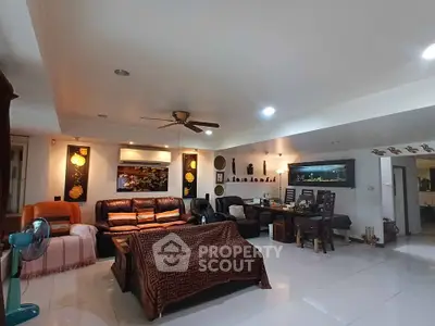 Spacious living room with modern decor and comfortable seating