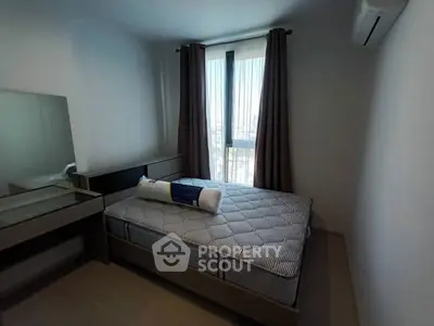 Cozy bedroom with modern furnishings and natural light