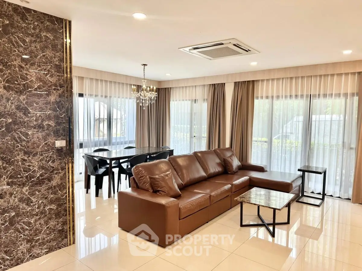 Luxurious living room with elegant decor and ample natural light