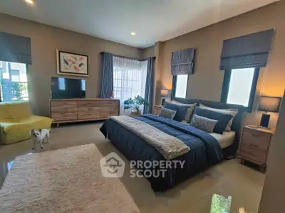 Spacious modern bedroom with stylish decor and natural light