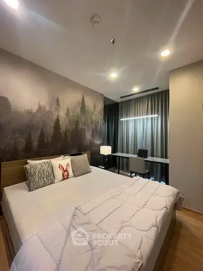 Modern bedroom with forest mural and study area, featuring cozy bedding and stylish decor.