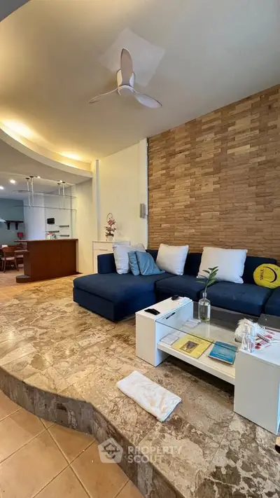 Stylish living room with modern decor and open kitchen layout