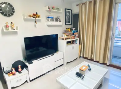 Charming living room with modern decor and entertainment center, featuring a sleek TV and stylish shelving.