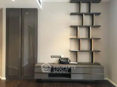 Modern living room with stylish shelving and wooden flooring