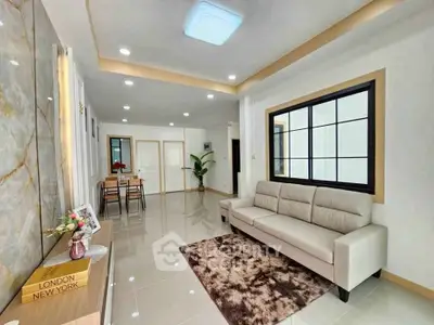 Spacious modern living room with elegant decor and ample natural light