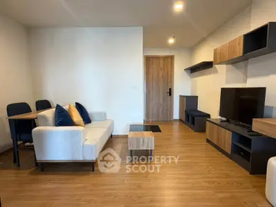 Modern living room with stylish furniture and wooden flooring
