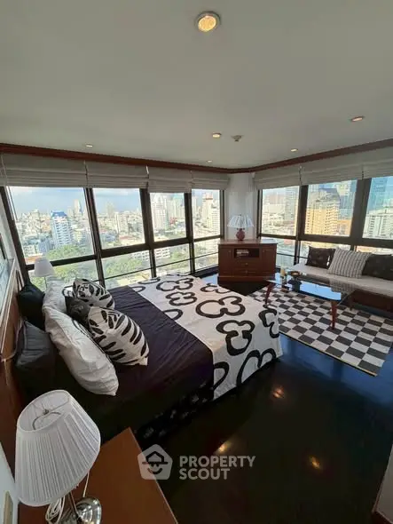 Luxurious bedroom with panoramic city view and stylish decor
