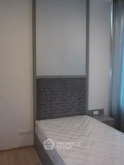 Modern minimalist bedroom with sleek design and natural light