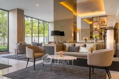 Luxurious modern living room with elegant decor and large windows offering garden views.