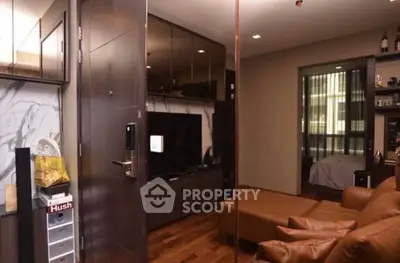 Modern living room with leather sofa and sleek entertainment center in stylish apartment