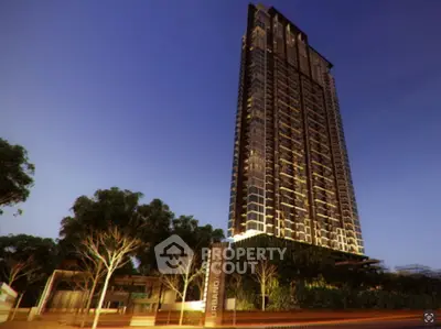 Stunning high-rise building with modern architecture and lush surroundings at dusk.
