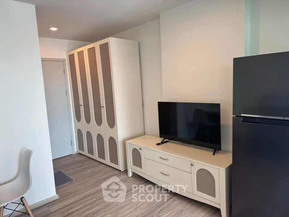 Modern living room with sleek TV stand and spacious wardrobe