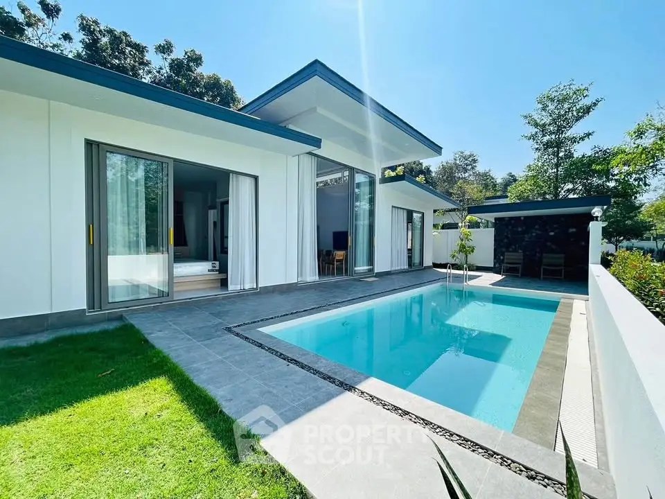 Modern villa with private pool and lush garden in serene setting