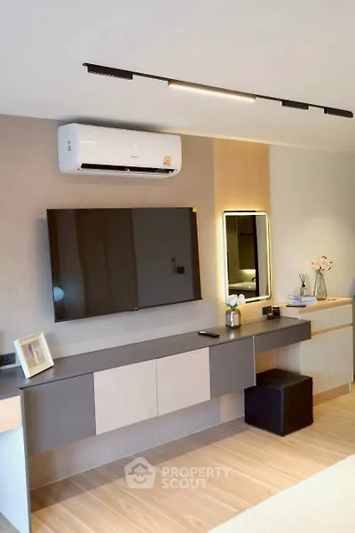 Modern living room with sleek TV setup and stylish decor