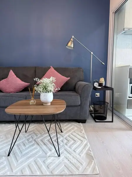 Stylish living room with modern sofa, chic coffee table, and elegant decor accents.
