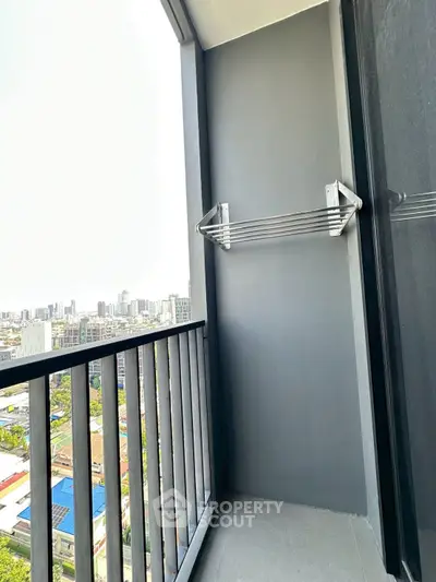 Modern balcony with city view and sleek railing in urban apartment