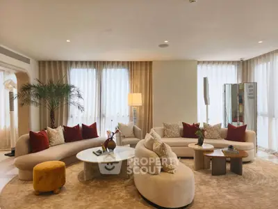 Luxurious living room with elegant furniture and natural light, perfect for relaxation and entertaining.