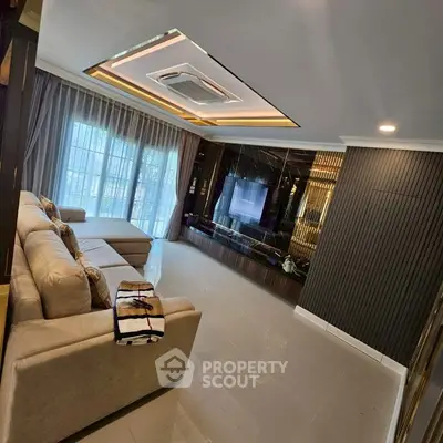 Luxurious living room with modern decor and large windows