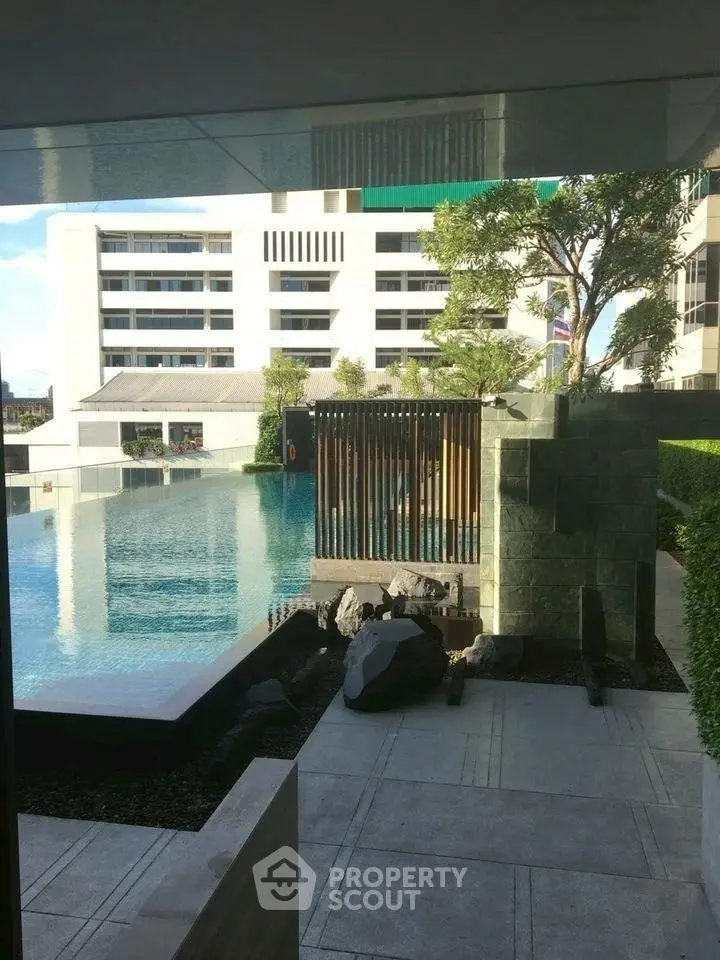 Luxurious modern apartment with stunning pool and garden view