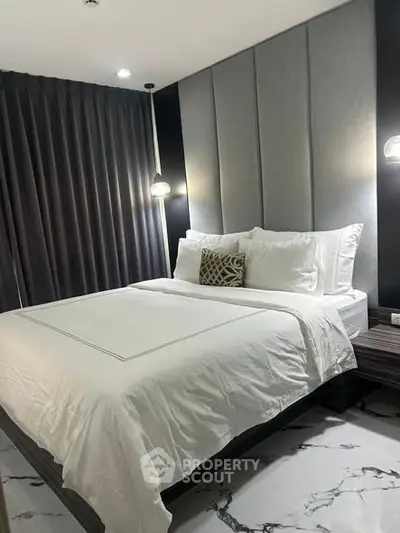 Luxurious bedroom with modern decor and elegant lighting