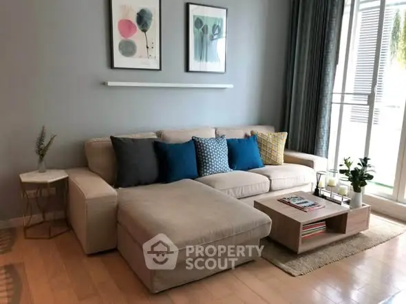 Stylish living room with modern decor and cozy seating area, perfect for relaxation and entertaining.