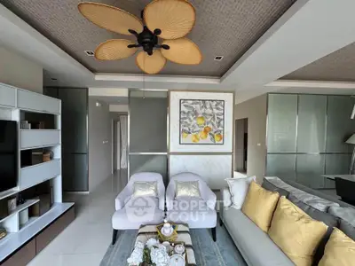 Luxurious living room with elegant decor and modern ceiling fan, perfect for relaxation and entertainment.