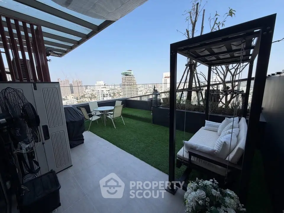 Stunning rooftop terrace with city views and cozy seating area