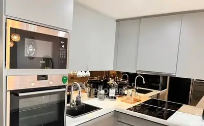 Modern kitchen with sleek appliances and open layout design