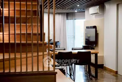 Modern living room with wooden staircase and sleek dining area