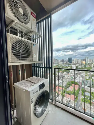 High-rise balcony with city view and laundry appliances, perfect for urban living.
