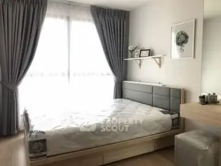 Bright modern bedroom with large window and stylish decor