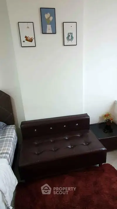 Cozy bedroom corner with stylish decor and comfortable seating