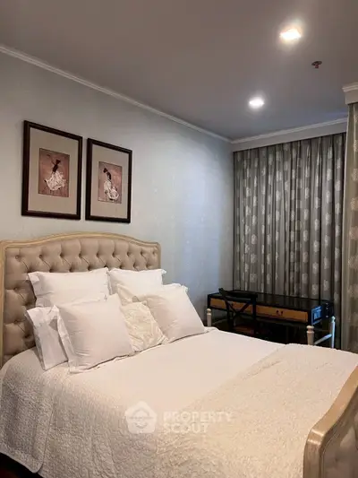 Elegant bedroom with plush bed and stylish decor in a cozy setting.