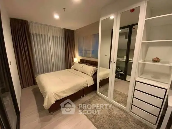 Cozy bedroom with modern decor and ample storage space