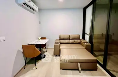 Modern living room with sleek furniture and air conditioning in a stylish apartment.