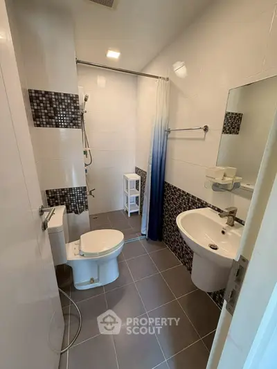 Modern bathroom with sleek fixtures and stylish tile accents