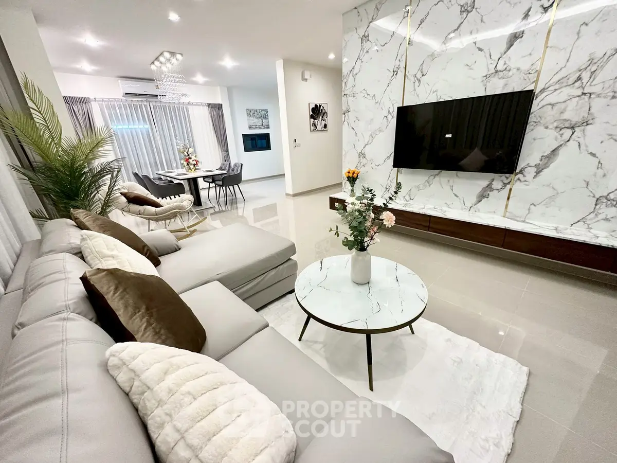 Luxurious modern living room with marble accents and elegant decor