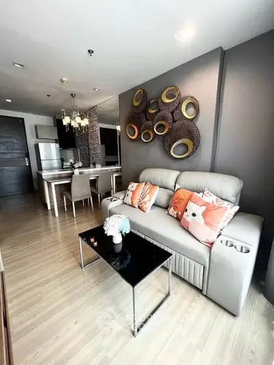 Modern living room with stylish decor and open kitchen layout