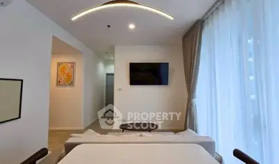 Modern living room with stylish lighting and large window drapes